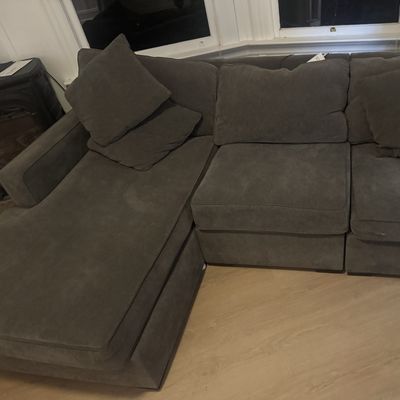Gray fabric sectional sofa with a chaise
